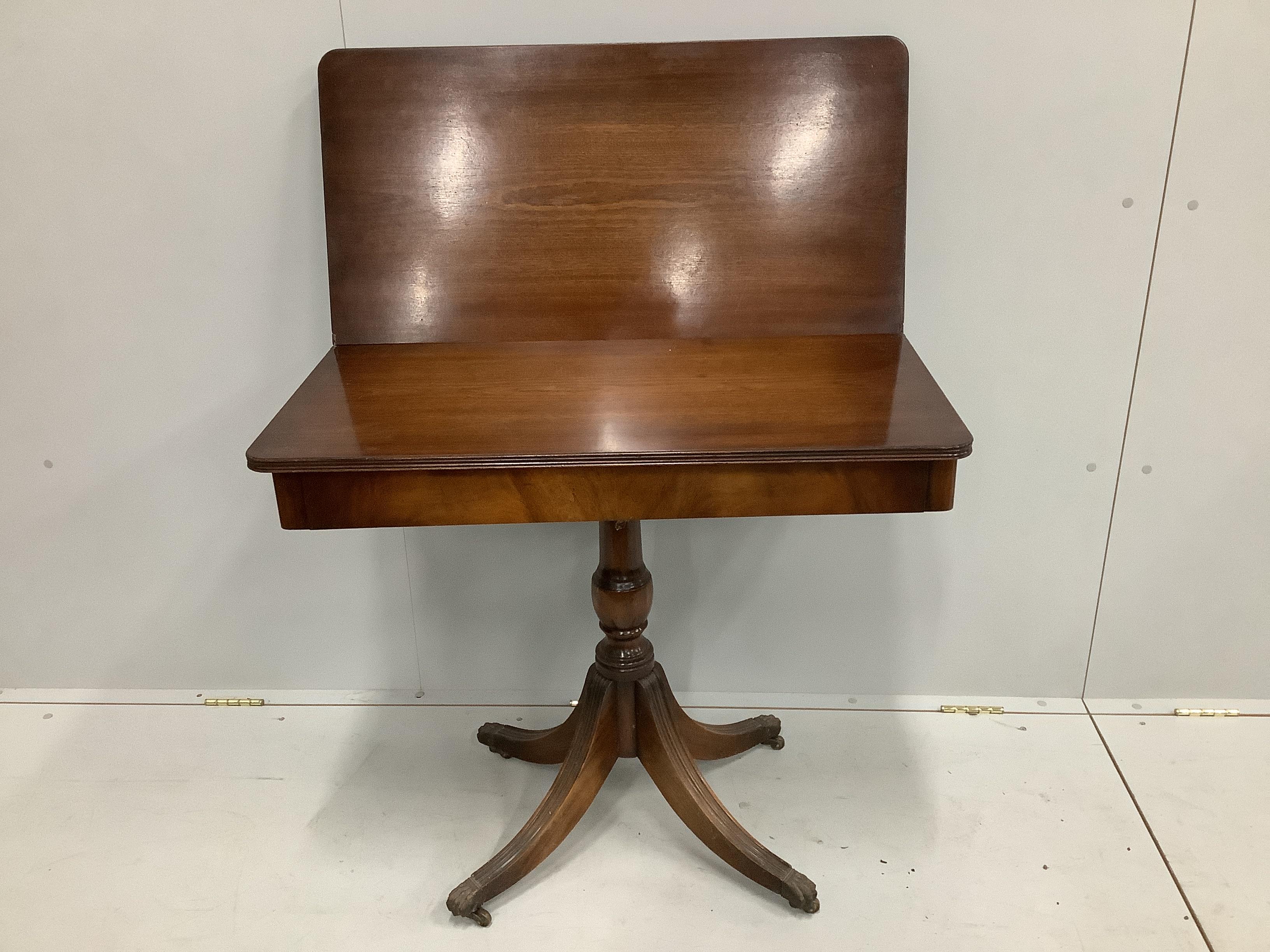 A reproduction Regency style mahogany folding tea table, width 85cm, depth 42cm, height 76cm